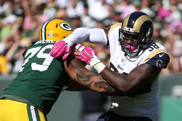 GREEN BAY, WI - OCTOBER 11:    Josh Walker #79 of the Green Bay Packers blocks Nick Fairley #98 of the St. Louis Rams in the second quarter at Lambeau Field on October 11, 2015 in Green Bay, Wisconsin.  (Photo by Jonathan Daniel/Getty Images)