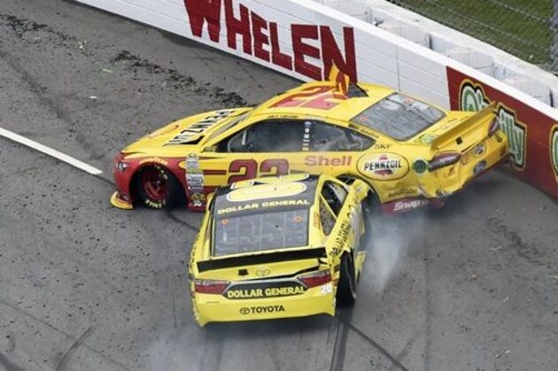 FILE - In this Nov. 1, 2015, file photo, Joey Logano (22) and Matt Kenseth (20) tangle in Turn 1 during the NASCAR Sprint Cup Series auto race at Martinsville Speedway in Martinsville, Va. It's the wild west in NASCAR right now, and it's not clear if that's good or bad for this championship battle. Drivers are doing whatever they have to do to make it to the finale, to mixed reactions.  (AP Photo/Don Petersen, File)