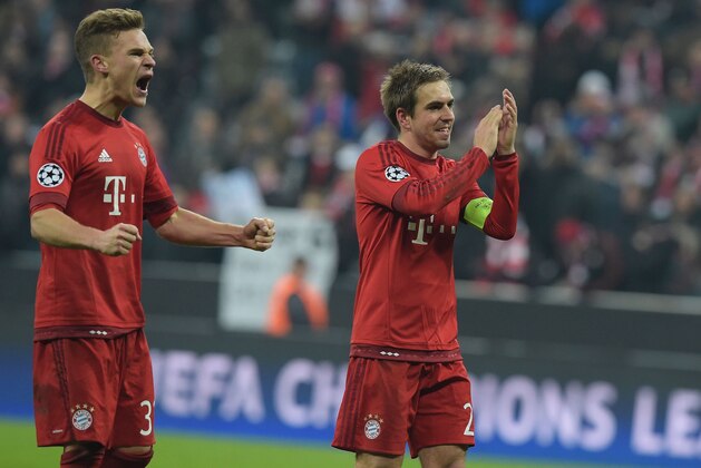 Bayern Munich's midfielder Joshua Kimmich (L) and Bayern Munich's defender Philipp Lahm celebrate after the UEFA Champions League, Round of 16, second leg football match FC Bayern Munich v Juventus in Munich, southern Germany on March 16, 2016. / AFP / TOBIAS SCHWARZ        (Photo credit should read TOBIAS SCHWARZ/AFP/Getty Images)