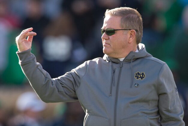 Nov 14, 2015; South Bend, IN, USA; Notre Dame Fighting Irish head coach Brian Kelly signals to his players during warmups before the game against the Wake Forest Demon Deacons at Notre Dame Stadium. Notre Dame won 28-7. Mandatory Credit: Matt Cashore-USA TODAY Sports