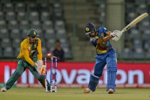 Sri Lanka's Dinesh Chandimal is bowled by South Africa's Aaron Phangiso during their ICC Twenty20 2016 Cricket World Cup match at the Feroz Shah Kotla Cricket Stadium in New Delhi, India, Monday, March 28, 2016. (AP Photo/Manish Swarup)