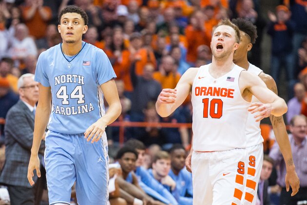 SYRACUSE, NY - JANUARY 09:  Trevor Cooney #10 of the Syracuse Orange tries to excited the crowd while walking downcourt alongside Justin Jackson #44 of the North Carolina Tar Heels and Malachi Richardson #23 of the Syracuse Orange on January 9, 2016 at The Carrier Dome in Syracuse, New York.  North Carolina defeats Syracuse 84-73.  (Photo by Brett Carlsen/Getty Images)