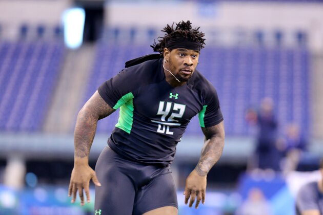 Mississippi defensive lineman Robert Nkemdiche performs a drill at the NFL football scouting combine Sunday, Feb. 28, 2016, in Indianapolis. (AP Photo/Gregory Payan)