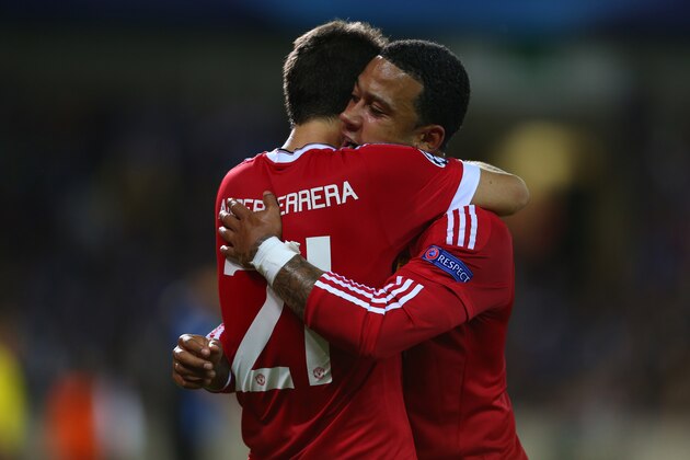BRUGGE, BELGIUM - AUGUST 26: Memphis Depay of Manchester United hugs Ander Herrera of Manchester United as he celebrates after he scores to make it 0-4 during the UEFA Champions League Qualifying Round Play Off Second Leg between Club Brugge and Manchester United on August 26, 2015 in Brugge, Belgium. (Photo by Catherine Ivill - AMA/Getty Images)
