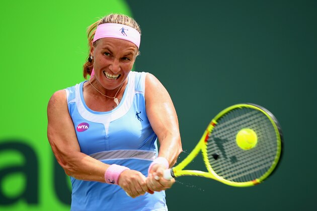 KEY BISCAYNE, FL - MARCH 28:  Svetlana Kuznetsova of Russia plays a backhand against Serena Williams of the United States in their fourth round match during the Miami Open Presented by Itau at Crandon Park Tennis Center on March 28, 2016 in Key Biscayne, Florida.  (Photo by Clive Brunskill/Getty Images)