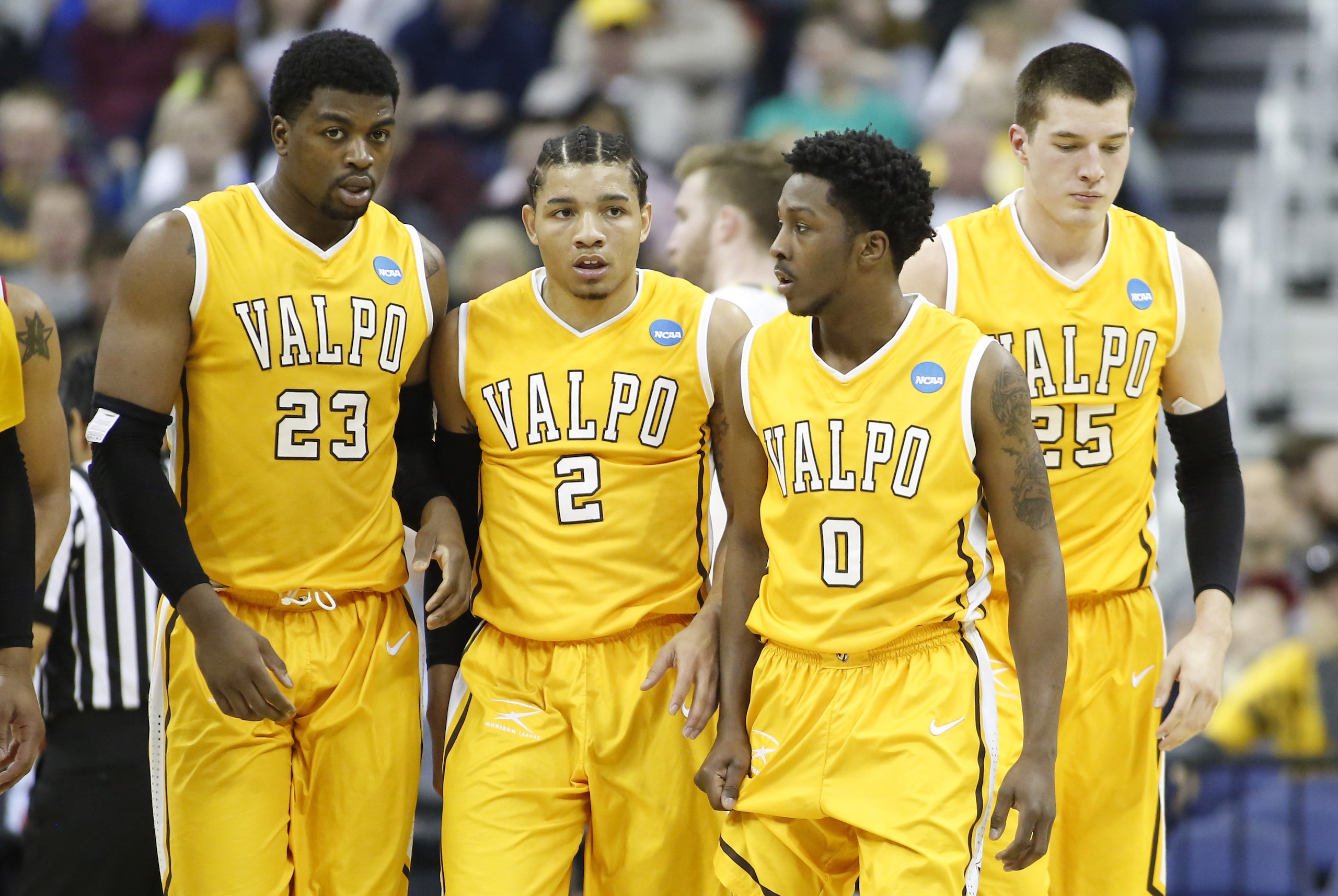 Mar 20, 2015; Columbus, OH, USA; Valparaiso Crusaders forward Jubril Adekoya (23), guard Tevonn Walker (2),  guard Keith Carter (0), and forward Alec Peters (25) walk on the court during the first half against the Maryland Terrapins in the second round of the 2015 NCAA Tournament at Nationwide Arena. Mandatory Credit: Joe Maiorana-USA TODAY Sports