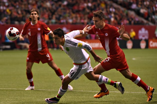Canada's National Team (red) vs Mexico (white) play in 2018 FIFA World Cup Russia, qualifier action at BC Place Stadium in Vancouver on March 25, 2016.



Mexico won 3-0 over Canada. / AFP / Don MacKinnon        (Photo credit should read DON MACKINNON/AFP/Getty Images)