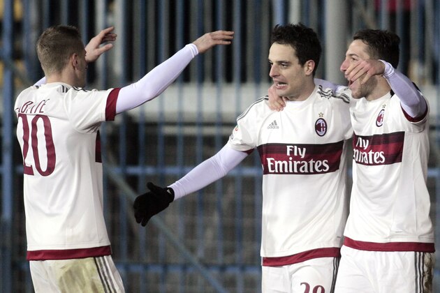 AC Milan's Giacomo Bonaventura, center, is celebrated by teammates Ignazio Abate, left, and Andrea Bertolacci, after scoring during a Serie A soccer match between Empoli and AC Milan, in Empoli, Italy, Saturday, Jan. 23, 2016. (AP Photo/Paolo Lazzeroni)