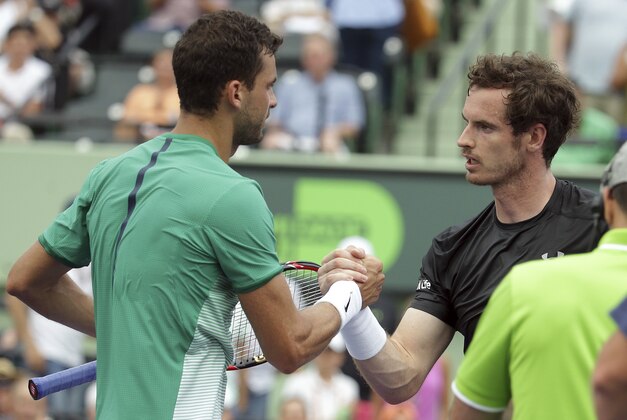 Andy Murray, of Great Britain, right, shakes hands with Grigor Dimitrov, of Bulgaria, left, after their match at the Miami Open tennis tournament, Monday, March 28, 2016, in Key Biscayne, Fla. Dimitrov won 6-7 (1), 6-4, 6-3. (AP Photo/Lynne Sladky)