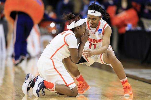 Syracuse guard Alexis Peterson, left, celebrates with teammate Cornelia Fondren at the end of a regional final women's college basketball game against Tennessee in the NCAA Tournament, Sunday, March 27, 2016, in Sioux Falls, S.D. Peterson scored 29 points as Syracuse won 89-67. (AP Photo/Charlie Neibergall)