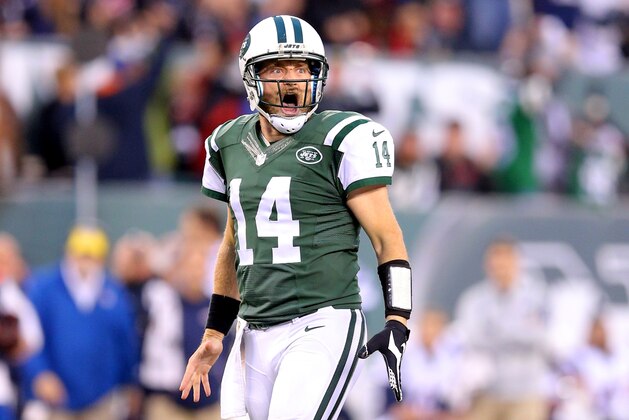 New York Jets quarterback Ryan Fitzpatrick (14) reacts after throwing a game winning touchdown in overtime against the New England Patriots during an NFL game at MetLife Stadium in East Rutherford, N.J. on Sunday, Dec. 27, 2015. (AP Photo/Brad Penner)