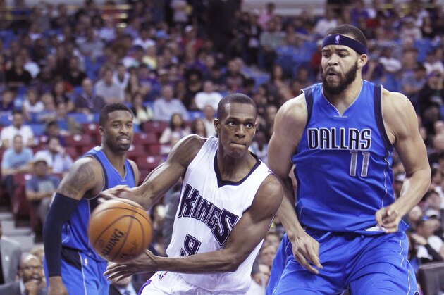 Sacramento Kings guard Rajon Rondo (9) drives to the basket against Dallas Mavericks defender JaVale McGee (11) during the second half of an NBA basketball game in Sacramento, Calif., Sunday, March. 27, 2016. The Kings won 133-111. (AP Photo/Steve Yeater)