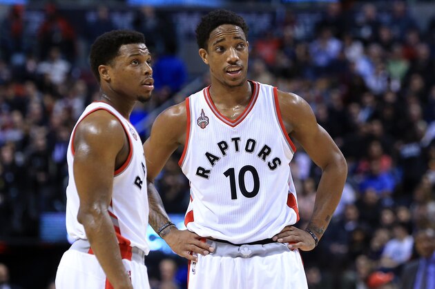 TORONTO, ON - MARCH 28:  Kyle Lowry #7 and DeMar DeRozan #10 of the Toronto Raptors talk during the first half of an NBA game against the Oklahoma City Thunder at the Air Canada Centre on March 28, 2016 in Toronto, Ontario, Canada.  NOTE TO USER: User expressly acknowledges and agrees that, by downloading and or using this photograph, User is consenting to the terms and conditions of the Getty Images License Agreement.  (Photo by Vaughn Ridley/Getty Images)