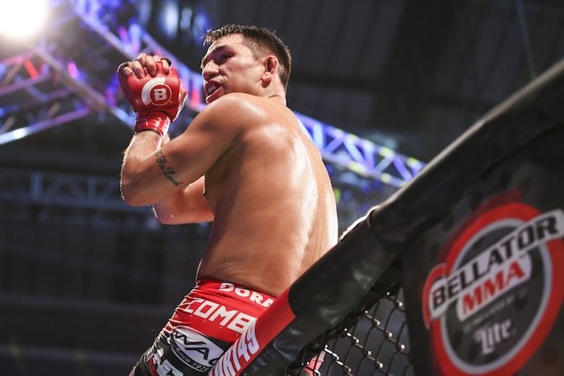 Feb 19, 2016; Houston, TX, USA; Emmanuel Sanchez (red gloves) celebrates after winning his fight against Daniel Pineda (not pictured) during their featherweight fight at Bellator 149 at Toyota Center. Mandatory Credit: Troy Taormina-USA TODAY Sports