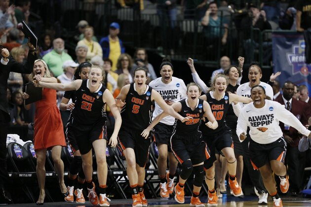 Oregon State rush the court in celebration of a 60-57 win over Baylor in a regional final of the women's NCAA college basketball tournament, Monday, March 28, 2016, in Dallas. (AP Photo/Brandon Wade)