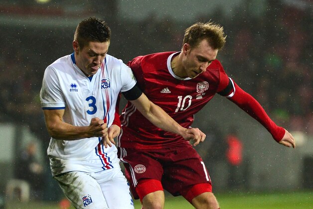 HERNING, DENMARK - MARCH 24:  Haukur Heidar Hauksson of Iceland (L) battles for the ball with Christian Eriksen of Denmark during the International Friendly match between Denmark and Iceland at the MCH Arena on March 24, 2016 in Herning, Denmark.  (Photo by Dan Mullan/Getty Images)