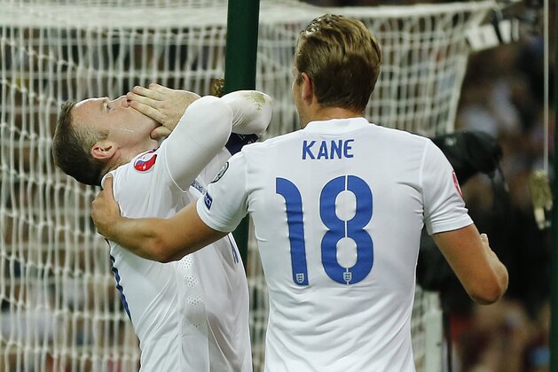 England’s Wayne Rooney celebrates with Harry Kane after scoring his side's second goal during the Euro 2016 Group E qualifying soccer match between England and Switzerland at Wembley stadium in London, England, Tuesday, Sept. 8, 2015 . Rooney scored his 50th international goal to top England's all time goal scorers at this level. (AP Photo/Frank Augstein)