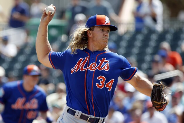New York Mets' starting pitcher Noah Syndergaard throws during the first inning of an exhibition spring training baseball game against the Miami Marlins, Tuesday, March 15, 2016, in Jupiter, Fla. (AP Photo/Brynn Anderson)