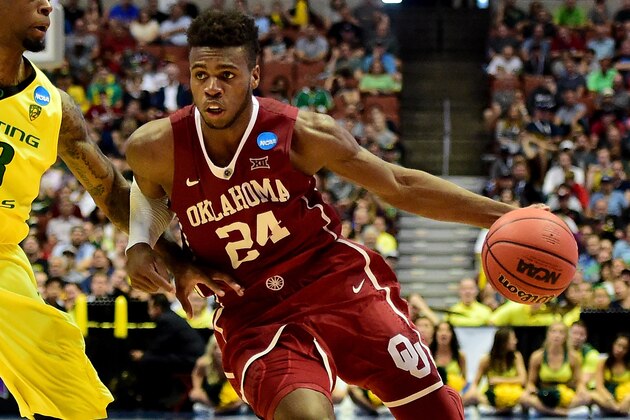 ANAHEIM, CA - MARCH 26:  Buddy Hield #24 of the Oklahoma Sooners drives on Elgin Cook #23 of the Oregon Ducks in the second half in the NCAA Men's Basketball Tournament West Regional Final at Honda Center on March 26, 2016 in Anaheim, California.  (Photo by Harry How/Getty Images)