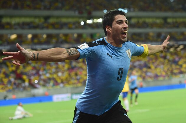 Uruguay's Luis Suarez celebrates after scoring against Brazil during their Russia 2018 FIFA World Cup South American Qualifiers' football match, in Recife, northeastern Brazil, on March 25, 2016.   AFP PHOTO / CHRISTOPHE SIMON / AFP / CHRISTOPHE SIMON        (Photo credit should read CHRISTOPHE SIMON/AFP/Getty Images)