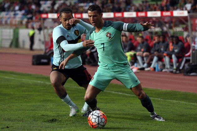 Portugal’s Cristiano Ronaldo, right, fights for the ball with Belgium’s Jason Denayer during a friendly soccer match between Portugal and Belgium in Leiria, Portugal, Tuesday, March 29 2016. (AP Photo/Steven Governo)