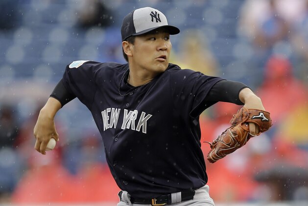 New York Yankees starting pitcher Masahiro Tanaka, of Japan, goes into his wind up against the Philadelphia Phillies during the first inning of a spring training baseball game Tuesday, March 29, 2016, in Clearwater, Fla. (AP Photo/Chris O'Meara)