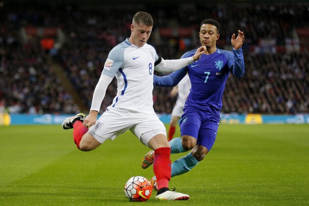 England's Ross Barkley, left, competes for the ball with The Netherlands' Memphis Depay during the international friendly soccer match between The Netherlands and England at Wembley stadium in London, Tuesday, March 29, 2016. (AP Photo/Frank Augstein)