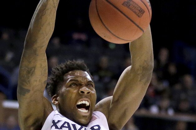 Xavier's Jalen Reynolds dunks the ball during the second half in a first-round men's college basketball game against Weber State in the NCAA tournament, Friday, March 18, 2016, in St. Louis. Xavier won 71-53. (AP Photo/Jeff Roberson)