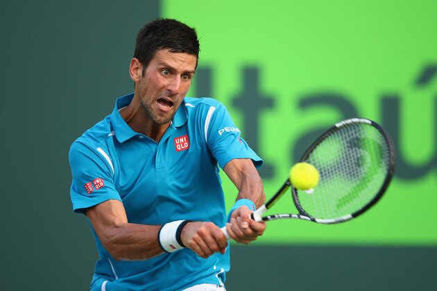 KEY BISCAYNE, FL - MARCH 27:  Novak Djokovic of Serbia plays a backhand against Joao Sousa of Portugal in their third round match during the Miami Open Presented by Itau at Crandon Park Tennis Center on March 27, 2016 in Key Biscayne, Florida.  (Photo by Clive Brunskill/Getty Images)