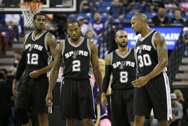 San Antonio Spurs, from left, LaMarcus Aldridge, Kawhi Leonard, Patty Mills, of Australia, and David West walk on to the court during the first quarter of an NBA preseason basketball game against the Sacramento Kings in Sacramento, Calif., Thursday Oct. 8, 2015. The Kings won 95-92.(AP Photo/Rich Pedroncelli) San Antonio Spurs, from left, LaMarcus Aldridge, Kawhi Leonard, Patty Mills, of Australia, and David West walk on to the court during the first quarter of an NBA preseason basketball game against the Sacramento Kings in Sacramento, Calif., Thursday Oct. 8, 2015. The Kings won 95-92.(AP Photo/Rich Pedroncelli)