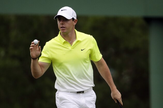Rory McIlroy, of Northern Ireland, holds up his ball after saving par on the third green during the fourth round of the Masters golf tournament Sunday, April 12, 2015, in Augusta, Ga. (AP Photo/Chris Carlson)