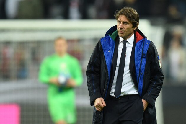 Italian headcoach Antonio Conte walks on the field after the friendly football match Germany vs Italy in Muinch, southern Germany, on March 29, 2016. 
Germany won the match 4-1. / AFP / CHRISTOF STACHE        (Photo credit should read CHRISTOF STACHE/AFP/Getty Images)