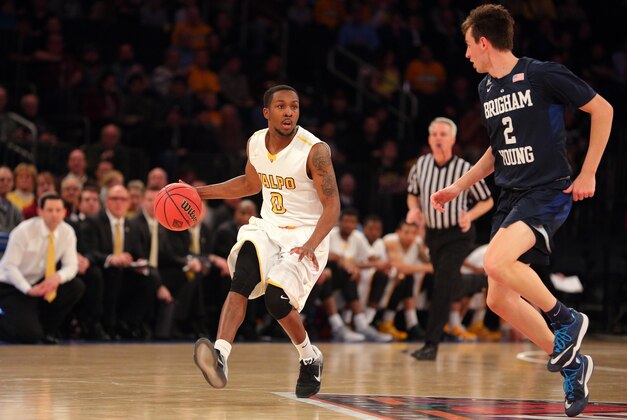 Mar 29, 2016; New York, NY, USA; Valparaiso Crusaders guard Keith Carter (0) dribbles the ball in front of BYU Cougars guard Zac Seljaas (2) during the first half of a semifinal game of the 2016 NIT basketball tournament at Madison Square Garden. Mandatory Credit: Brad Penner-USA TODAY Sports
