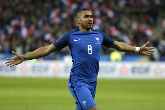 France’s Dimitri Payet celebrates his side's 3rd goal during the international friendly soccer match between France and Russia in Saint Denis, north of Paris, France, Tuesday, March 29, 2016. (AP Photo/Thibault Camus)