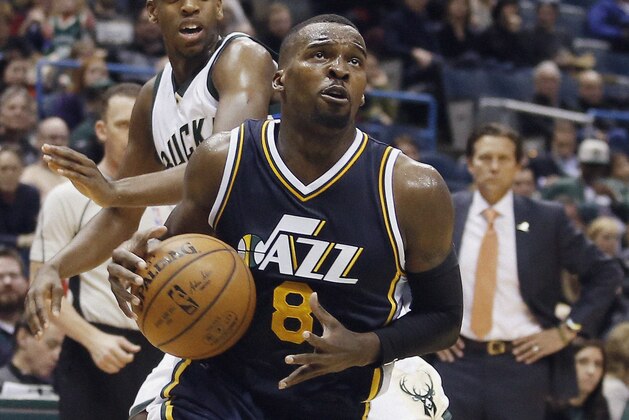 Utah Jazz's Shelvin Mack drives past Milwaukee Bucks' Khris Middleton during the second half of an NBA basketball game Sunday, March 20, 2016, in Milwaukee. (AP Photo/Morry Gash)
