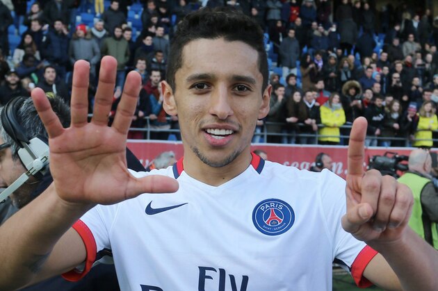 TROYES, FRANCE - MARCH 13:  Marquinhos of Paris Saint-Germain celebrates the victory of championship after the French  Ligue 1 between ESTAC Troyes and Paris Saint-Germain at Stade de l'Aube on march 13, 2016 in Troyes, France.  (Photo by Xavier Laine/Getty Images)