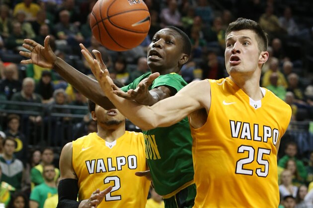 Valparaiso's Tevonn Walker, left, and Alec Peters, right, battle Oregon's Chris Boucher for a rebound during the second half of an NCAA college basketball game Sunday, Nov. 22, 2015, in Eugene, Ore. (AP Photo/Chris Pietsch)