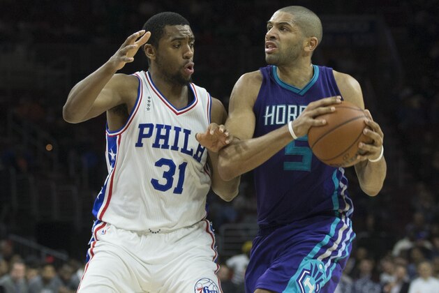 PHILADELPHIA, PA - MARCH 29: Nicolas Batum #5 of the Charlotte Hornets controls the ball against Hollis Thompson #31 of the Philadelphia 76ers on March 29, 2016 at the Wells Fargo Center in Philadelphia, Pennsylvania. The Hornets defeated the 76ers 100-85. NOTE TO USER: User expressly acknowledges and agrees that, by downloading and or using this photograph, User is consenting to the terms and conditions of the Getty Images License Agreement. (Photo by Mitchell Leff/Getty Images)