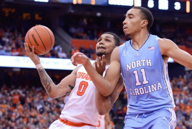 Jan 9, 2016; Syracuse, NY, USA; Syracuse Orange forward Michael Gbinije (0) prepares to take a lay up as North Carolina Tar Heels forward Brice Johnson (11) defends during the second half of a game at the Carrier Dome. North Carolina won 84-73. Mandatory Credit: Mark Konezny-USA TODAY Sports