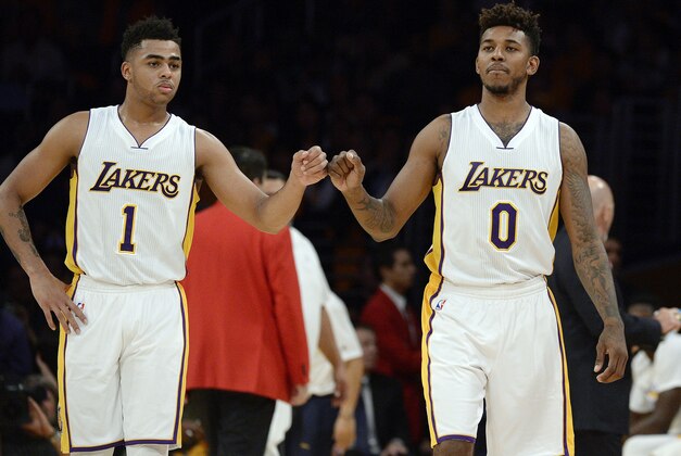 LOS ANGELES, CA - NOVEMBER 22: D'Angelo Russell #1 and Nick Young #0 of the Los Angeles Lakers pump fists during the second half of the basketball game against Portland Trail Blazers at Staples Center November 22, 2015 in Los Angeles, California. NOTE TO USER: User expressly acknowledges and agrees that, by downloading and or using the photograph, User is consenting to the terms and conditions of the Getty Images License Agreement. (Photo by Kevork Djansezian/Getty Images)