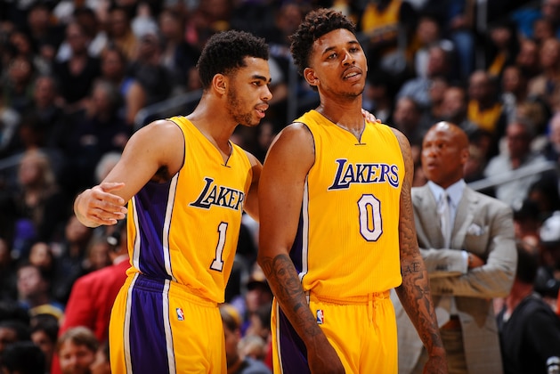 LOS ANGELES, CA - FEBRUARY 19:  D'Angelo Russell #1 of the Los Angeles Lakers and Nick Young #0 of the Los Angeles Lakers talk during the game against the San Antonio Spurs on February 19, 2016 at STAPLES Center in Los Angeles, California. NOTE TO USER: User expressly acknowledges and agrees that, by downloading and/or using this Photograph, user is consenting to the terms and conditions of the Getty Images License Agreement. Mandatory Copyright Notice: Copyright 2016 NBAE (Photo by Juan Ocampo/NBAE via Getty Images)