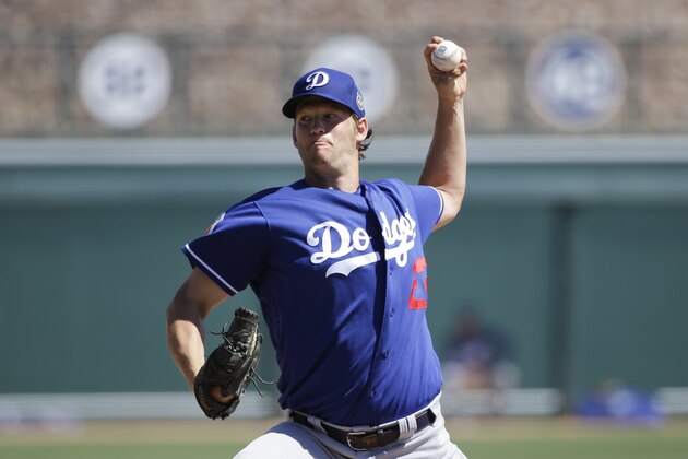 Los Angeles Dodgers starting pitcher Clayton Kershaw throws against the Chicago White Sox during a spring training baseball game Saturday, March 19, 2016, in Phoenix. (AP Photo/Jae C. Hong)