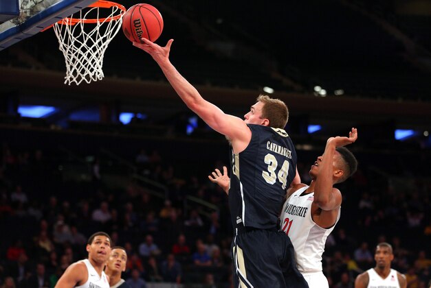 Mar 29, 2016; New York, NY, USA; George Washington Colonials forward Tyler Cavanaugh (34) drives against San Diego State Aztecs forward Malik Pope (21) during the second half of a semifinal game of the 2016 NIT basketball tournament at Madison Square Garden. George Washington defeated San Diego State 65-46. Mandatory Credit: Brad Penner-USA TODAY Sports