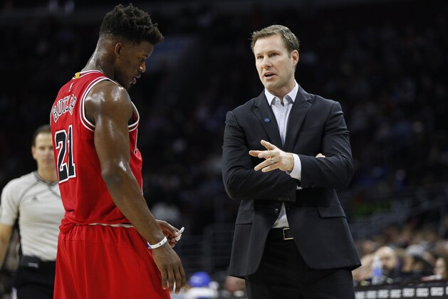 Chicago Bulls' head coach Fred Hoiberg, right, talks with Jimmy Butler, left, during the first half of an NBA basketball game against the Philadelphia 76ers, Thursday, Jan. 14, 2016, in Philadelphia. The Bulls won 115-111 in overtime. (AP Photo/Chris Szagola)