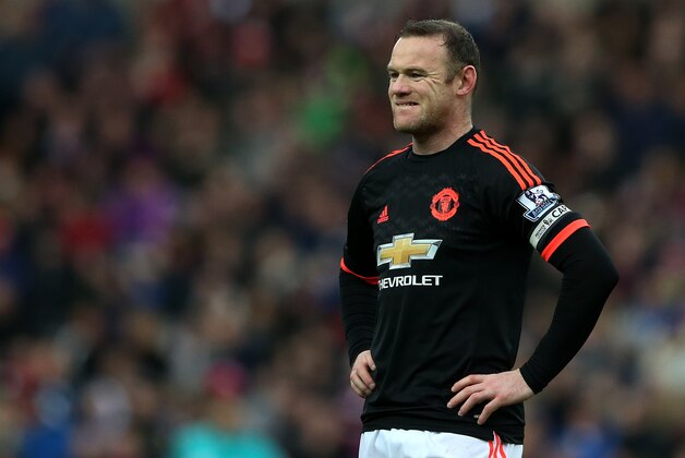 Manchester United's captain Wayne Rooney stands dejected as Sunderland's Wahbi Khazri celebrates his goal during the English Premier League soccer match between Sunderland and Manchester United at the Stadium of Light, Sunderland, England, Saturday, Feb. 13, 2016. (AP Photo/Scott Heppell)