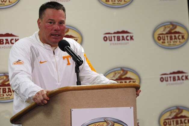 Jan 1, 2016; Tampa, FL, USA; Tennessee Volunteers head coach Butch Jones is presented the trophy as they beat the Northwestern Wildcats in the 2016 Outback Bowl at Raymond James Stadium. Tennessee Volunteers defeated the Northwestern Wildcats 45-6. Mandatory Credit: Kim Klement-USA TODAY Sports