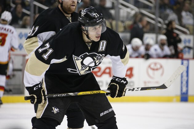 Pittsburgh Penguins center Evgeni Malkin (71) plays during an NHL hockey game against the Calgary Flames in Pittsburgh, Saturday, March 5, 2016. (AP Photo/Gene J. Puskar)