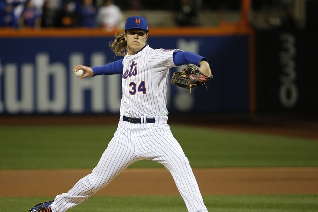New York Mets pitcher Noah Syndergaard winds up to throw during the first inning of Game 3 of the Major League Baseball World Series against the Kansas City Royals Friday, Oct. 30, 2015, in New York. (AP Photo/Matt Slocum) New York Mets pitcher Noah Syndergaard winds up to throw during the first inning of Game 3 of the Major League Baseball World Series against the Kansas City Royals Friday, Oct. 30, 2015, in New York. (AP Photo/Matt Slocum)