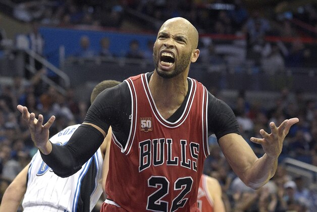 Chicago Bulls forward Taj Gibson (22) argues with an official during the second half of an NBA basketball game against the Orlando Magic in Orlando, Fla., Saturday, March 26, 2016. The Magic won 111-89. (AP Photo/Phelan M. Ebenhack)
