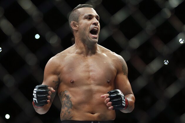 Vitor Belfort, from Brazil, celebrates after defeating Dan Henderson, from the United States, during their UFC middleweight mixed martial arts bout in Sao Paulo, Brazil, Sunday, Nov. 8, 2015. (AP Photo/Andre Penner) Vitor Belfort, from Brazil, celebrates after defeating Dan Henderson, from the United States, during their UFC middleweight mixed martial arts bout in Sao Paulo, Brazil, Sunday, Nov. 8, 2015. (AP Photo/Andre Penner)
